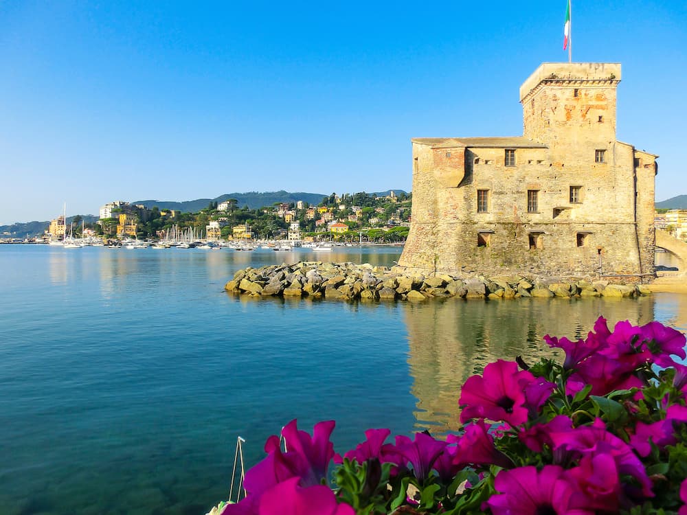 italian castles on sea italian flag - castle of Rapallo , Liguria Genoa Tigullio gulf near Portofino at Italy .