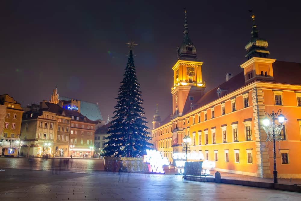 Christmas in Warsaw. Warsaw at night. Christmas tree on main square in evening.