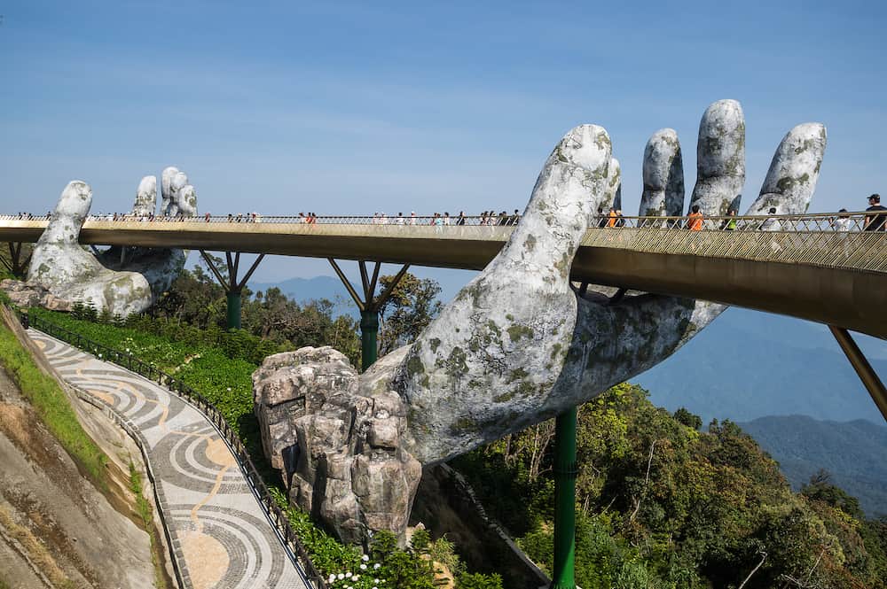 BA NA HILLS, VIETNAM - Golden Bridge in Ba Na Hills, a resort located in the Truong Son Mountains west of the city of Da Nang, in central Vietnam