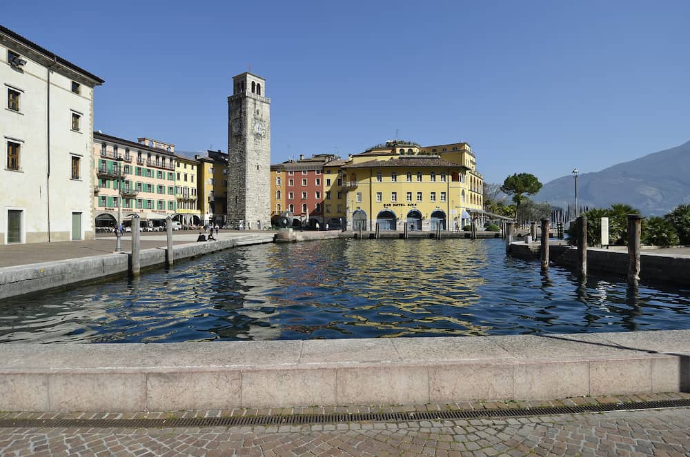 Riva del Garda Italy - Piazza III November and Apponale tower in sunny day in early spring