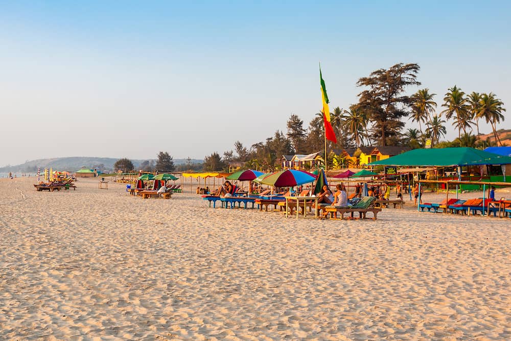 GOA, INDIA - Beach restaurant shacks and sunbeds on Arambol beach in north Goa, India