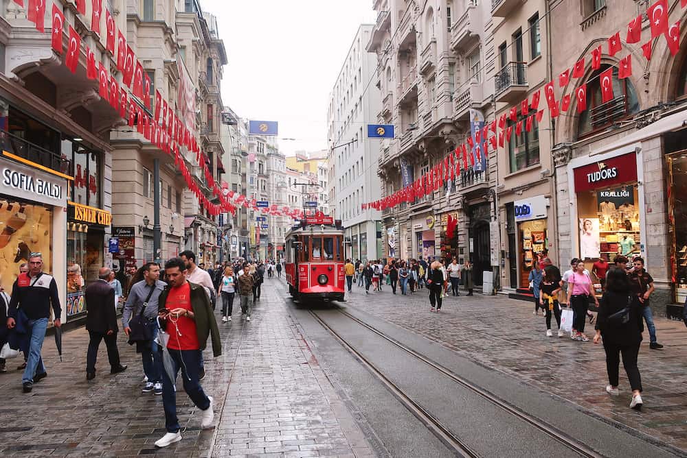 Istanbul, Turkey - Red nostalgic tram on Istiklal street. The pedestrian Istiklal street, the most touristic place of Istanbul