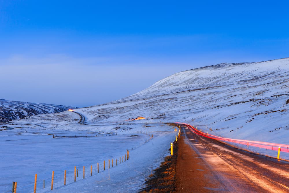 Winding road at dusk in winter, Northeast of Iceland. The Ring Road (Route 1) of Iceland, near Egilsstadir.