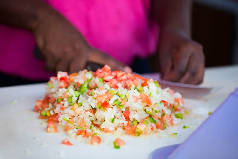 Close up of Bahamian woman making traditional conch salad