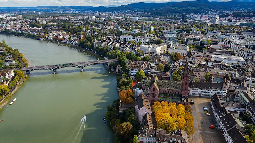 Aerial view over the city of Basel Switzerland and River Rhine - drone footage