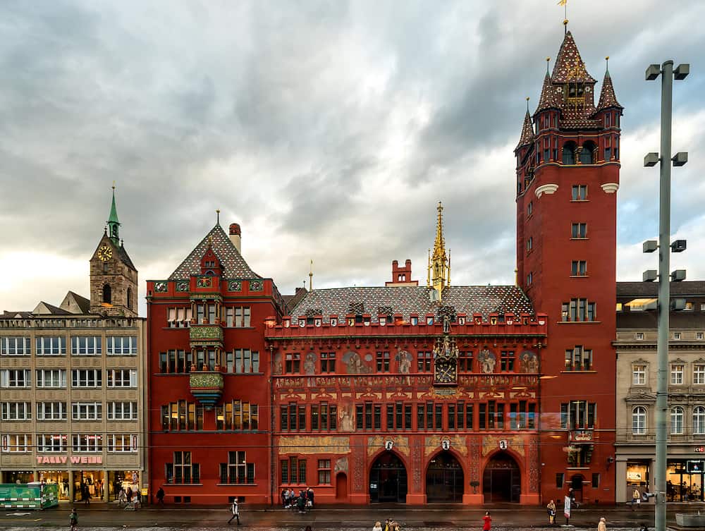 Basel, Switzerland - Famous red painted Town Hall or Rathaus building facade in Basel, Switzerland