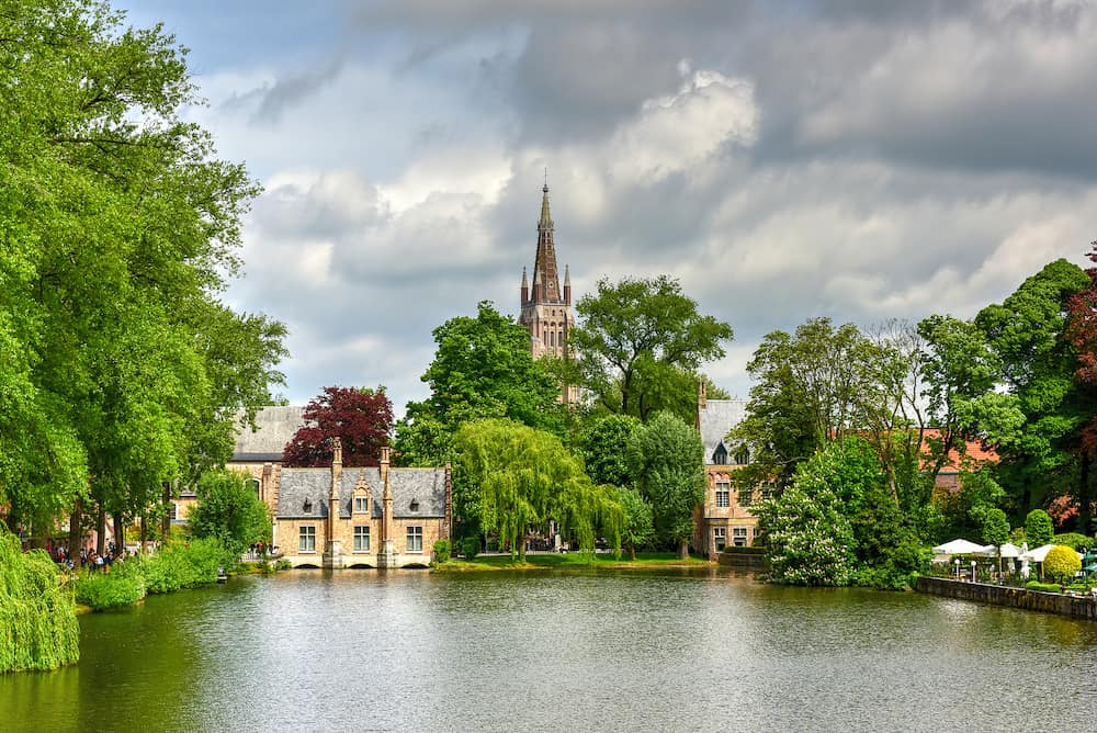 Minnewaterpark and Minnewater lake in the old city of Bruges Belgium.