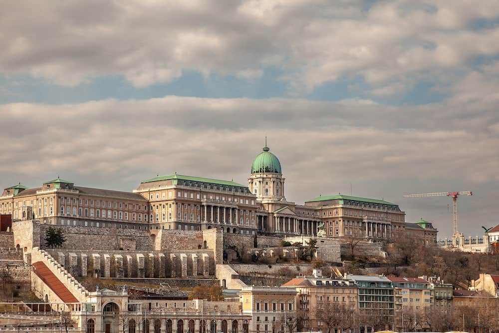 Budapest Buda Castle seen from Pest with the budavar palace in front. The castle is the historical palace complex of the Hungarian kings and a landmark of Budapest, Hungary.