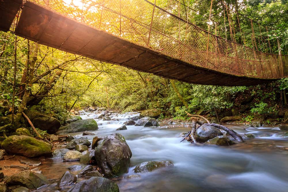 Hanging bridge over a creek in Rincon de la Vieja National Park in Costa Rica