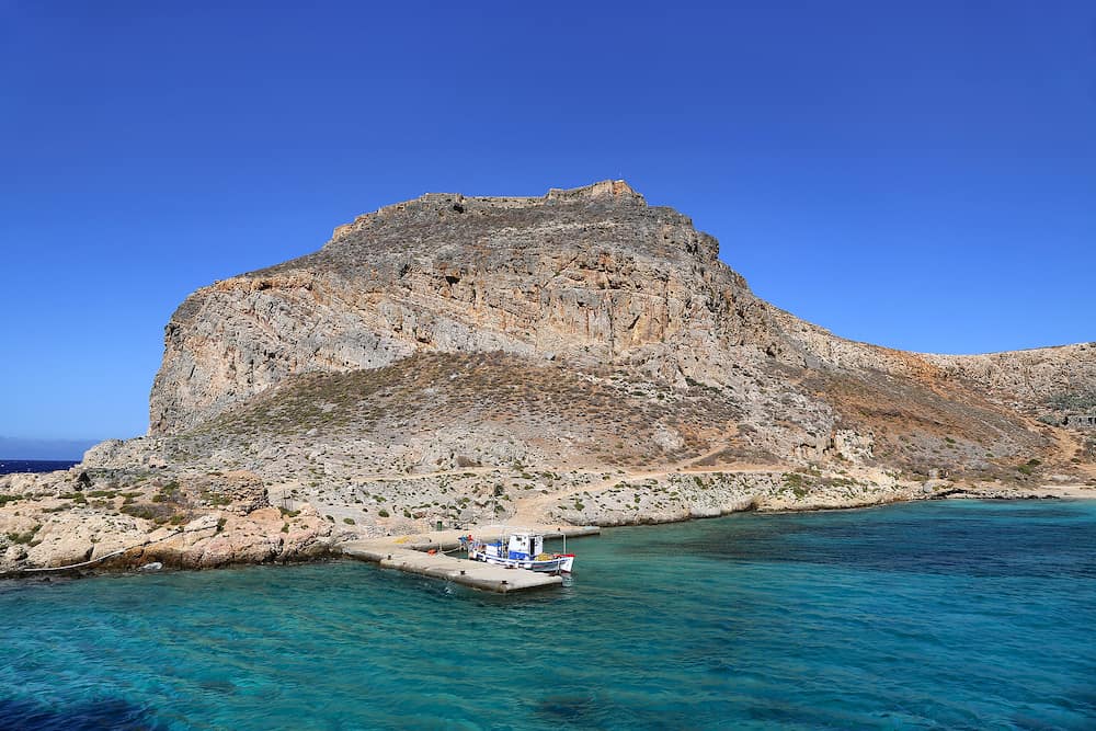 Sea view on the coast of the Gramvousa island with fortress on the top, Crete, Greece