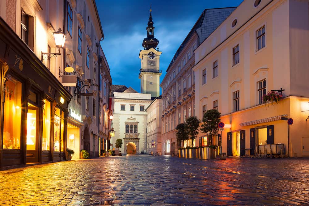 Linz, Austria. Cityscape image of old town Linz, Austria during twilight blue hour with reflection of the city lights.