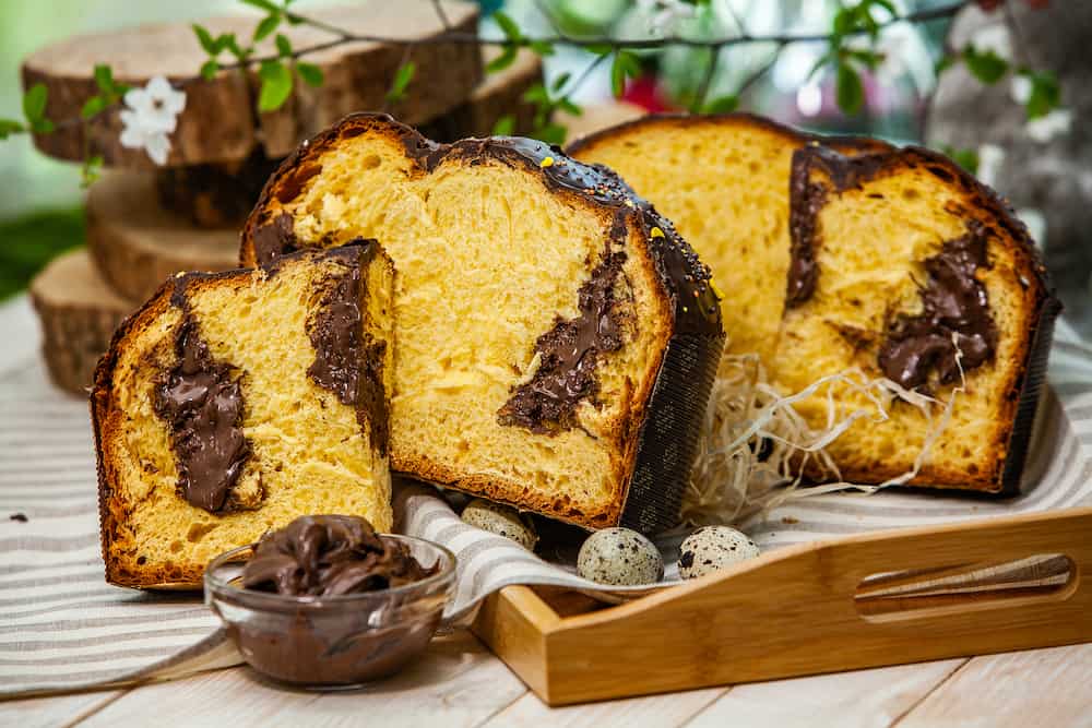 Panettone is the traditional Italian dessert for easter. Homemade panettone covered in chocolate. Sweet Bread served as dessert.