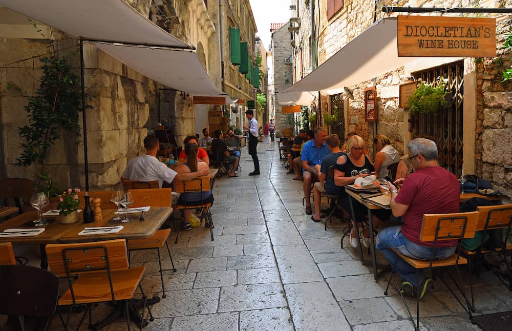 SPLIT, CROATIA - People eating in a restaurant within the walls of the Diocletian Palace Split Croatia.