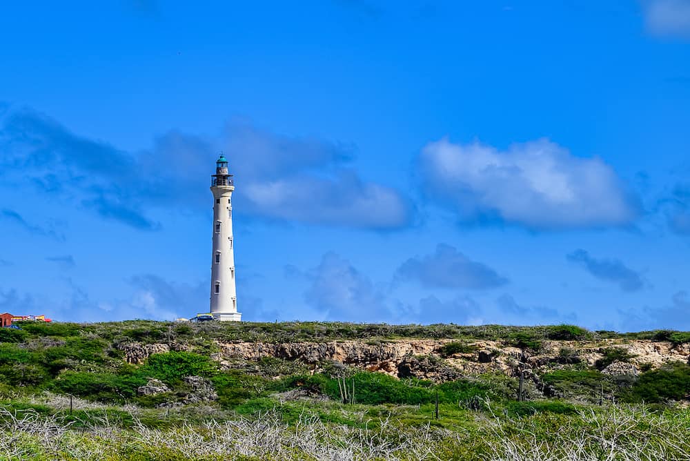 The California Lighthouse on the Caribbean island of Aruba under a blue sky with beautiful clouds