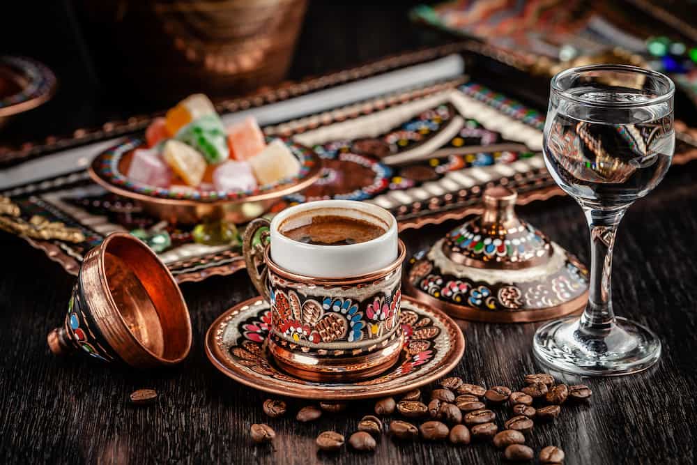 The concept of Turkish cuisine. Turkish brewed black coffee. Beautiful coffee serving in the restaurant. Background image