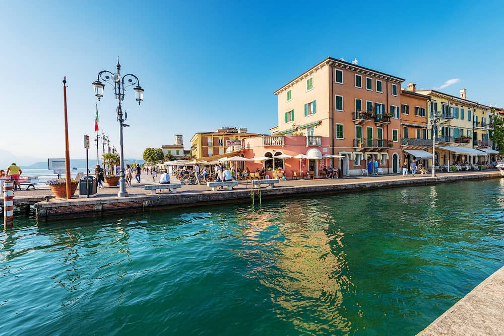 LAZISE, ITALY - Entrance of the small port of Lazise, village and tourist resort on the coast of Lake Garda (Lago di Garda). Verona province, Veneto, Italy, southern Europe.