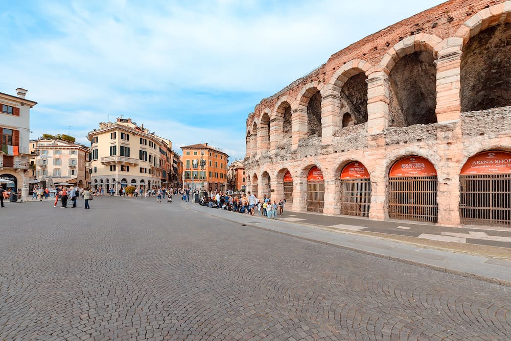 VERONA, ITALY - Panoramic view of central square and Arena Verona, Roman amphitheater. Tourists near Verona Arena Roman amphitheater in Verona, Italy, panorama.