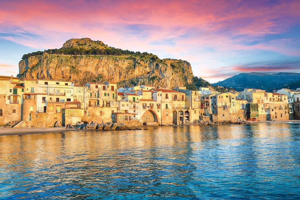 Breathtaking evening cityscape of Cefalu city. Popular travel destination of Mediterranean sea. Location: Cefalu, Province of Palermo, Sicily, Italy, Europe