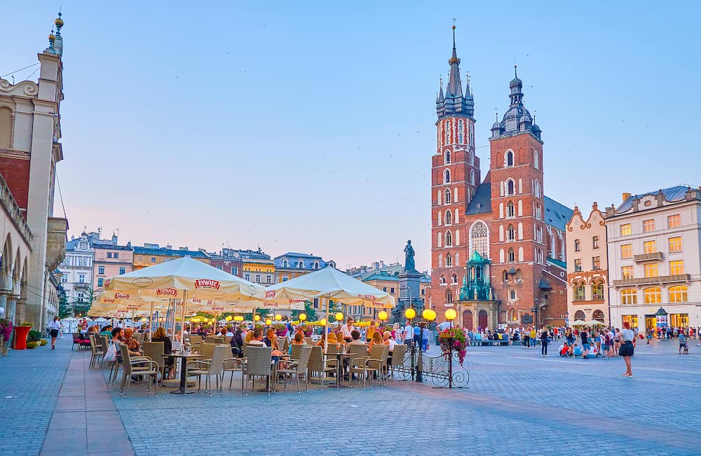 KRAKOW, POLAND - Evening is the best time to walk along center of Krakow enjoying beautiful medieval architecture and tasty local cuisine, in Krakow.