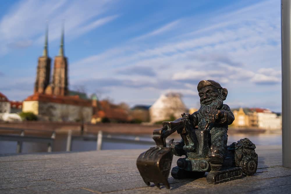 WROCLAW, POLAND - Bronze gnome on urban street