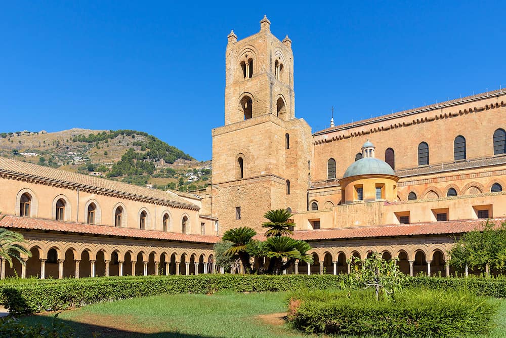 Courtyard and the tower of Benedictine Cloister beside the Monreale Abbey, Palermo, Italy
