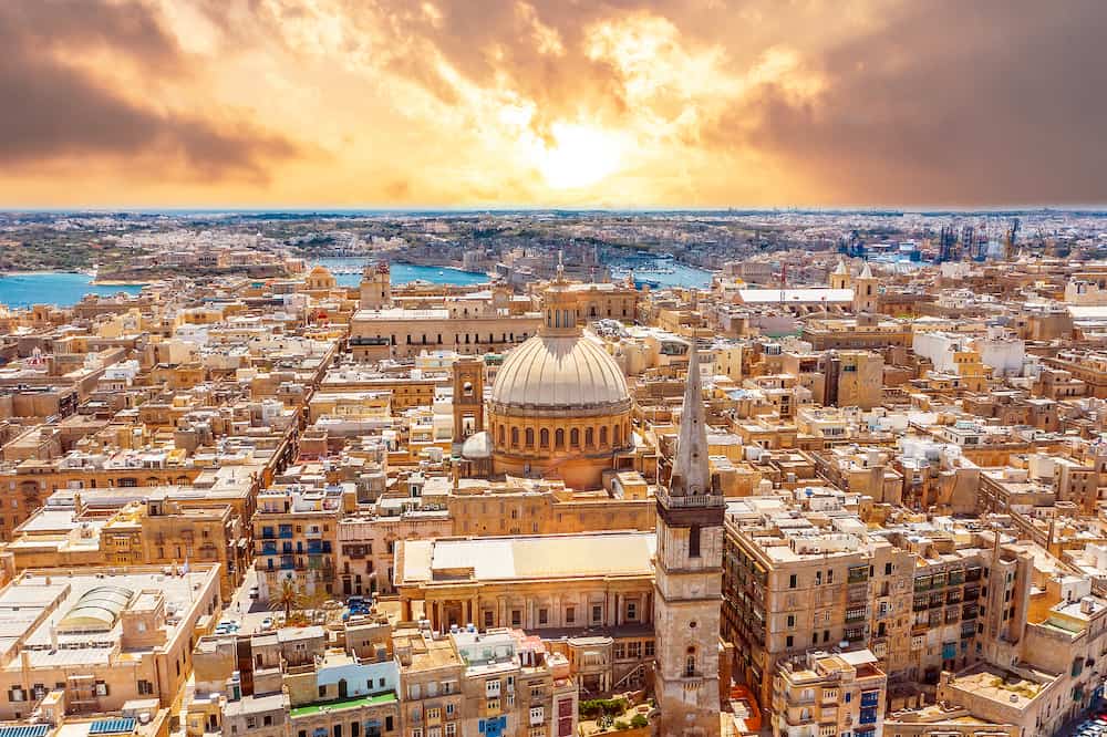 Aerial view early morning at sunrise of Lady of Mount Carmel church, St.Paul's Cathedral in Valletta city center, Malta