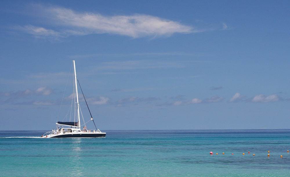 A typical holiday photo of a catamaran sailing in the Caribbean