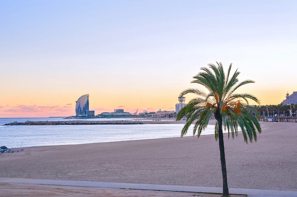Beautiful Barcelona Beach at sunset Platja Nova Icaria or Barceloneta view