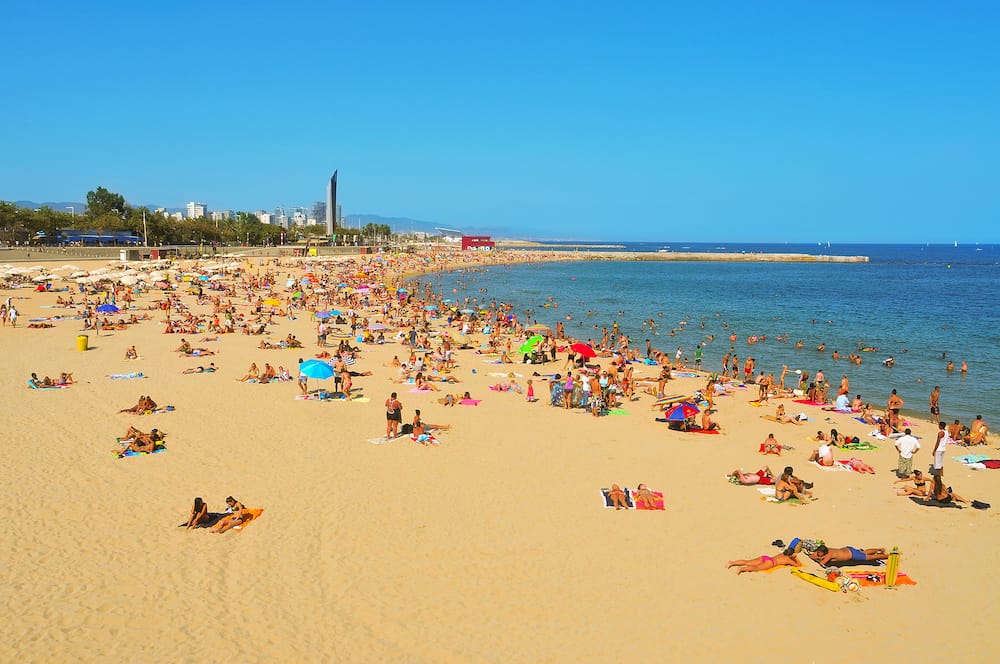 BARCELONA, SPAIN - La Nova Icaria Beach in Barcelona, Spain. This beach, arised with the urban redevelopment on the occasion of the 1992 Olympic Games, is 400 meters long