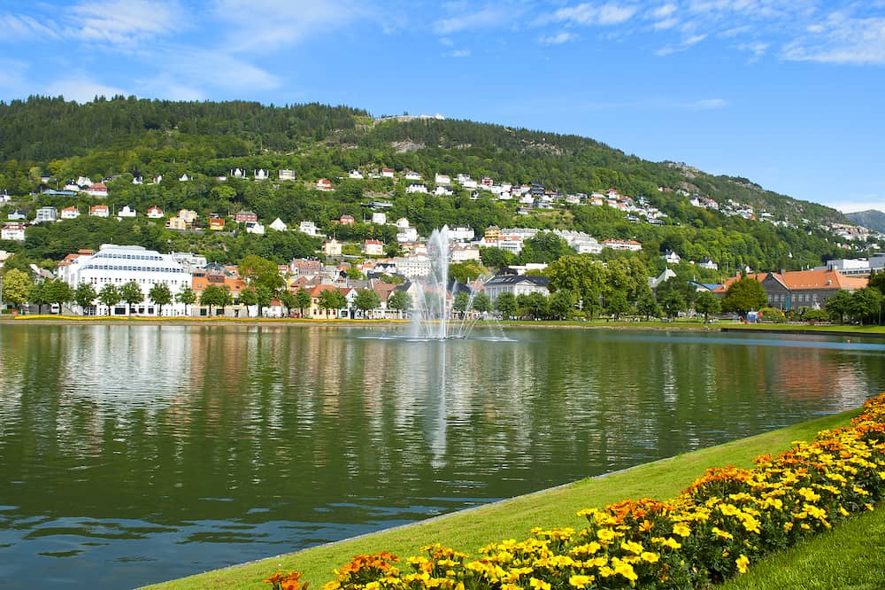 Bergen landscape with Floyen Mountain, colorful houses, fountain and Lille Lungegardsvannet or Smalungeren Lake in Hordaland county in Bergen, Norway