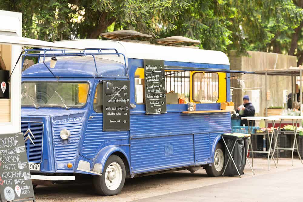 Bratislava. Slovakia. Diner on wheels at the park. Old blue bus converted into a food truck.