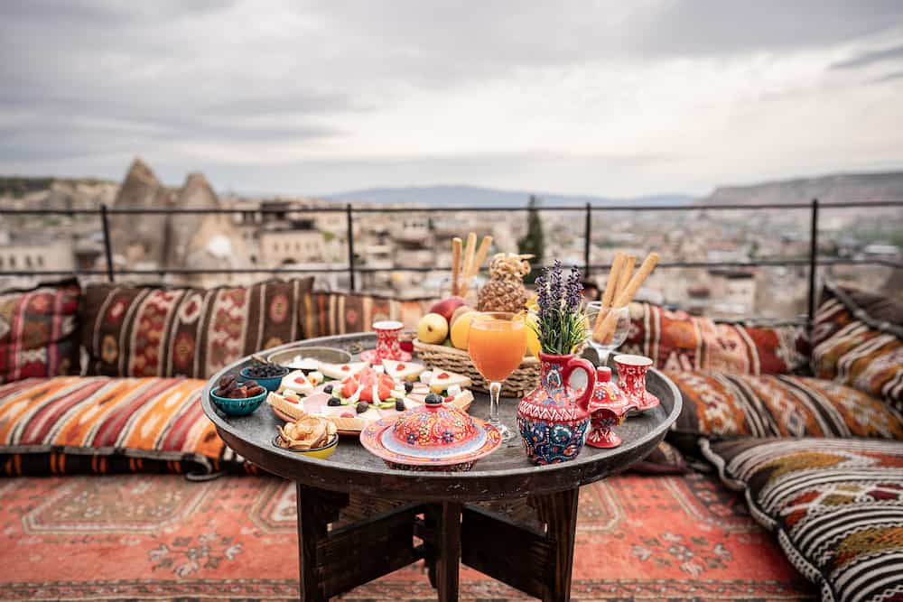 Breakfast with great landscape on rooftop of cave house in Goreme city, Cappadocia Turkey.