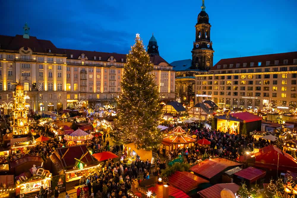 Dresden, Germany - People visit Christmas Market Striezelmarkt in Dresden, Germany. Christmas fair, European traditions