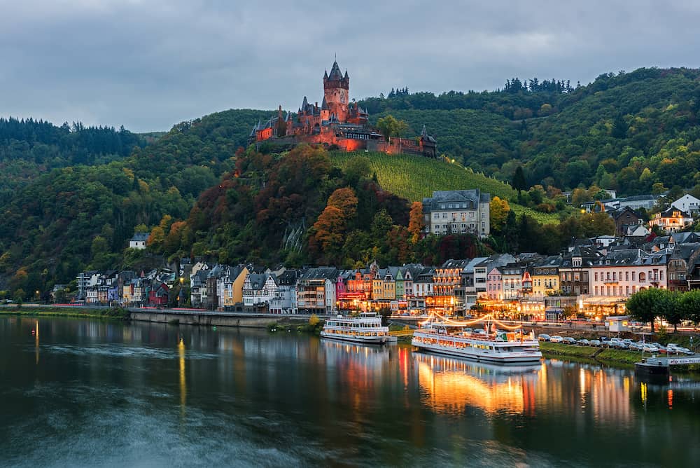 COCHEM, RHINELAND-PALATINATE / GERMANY - View of the town from the bridge across the Moselle River at dusk, Germany