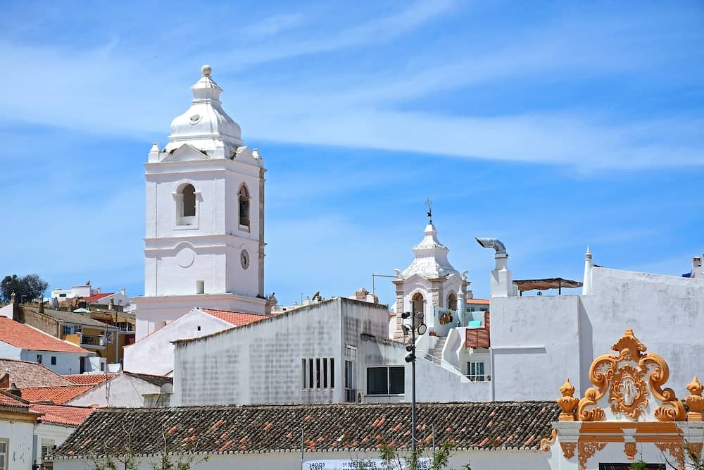 LAGOS, PORTUGAL - - Santo Antonio church bell tower (Igreja de Santo Antonio) in the old town seen from Infant Square, Lagos, Algarve, Portugal, Europe