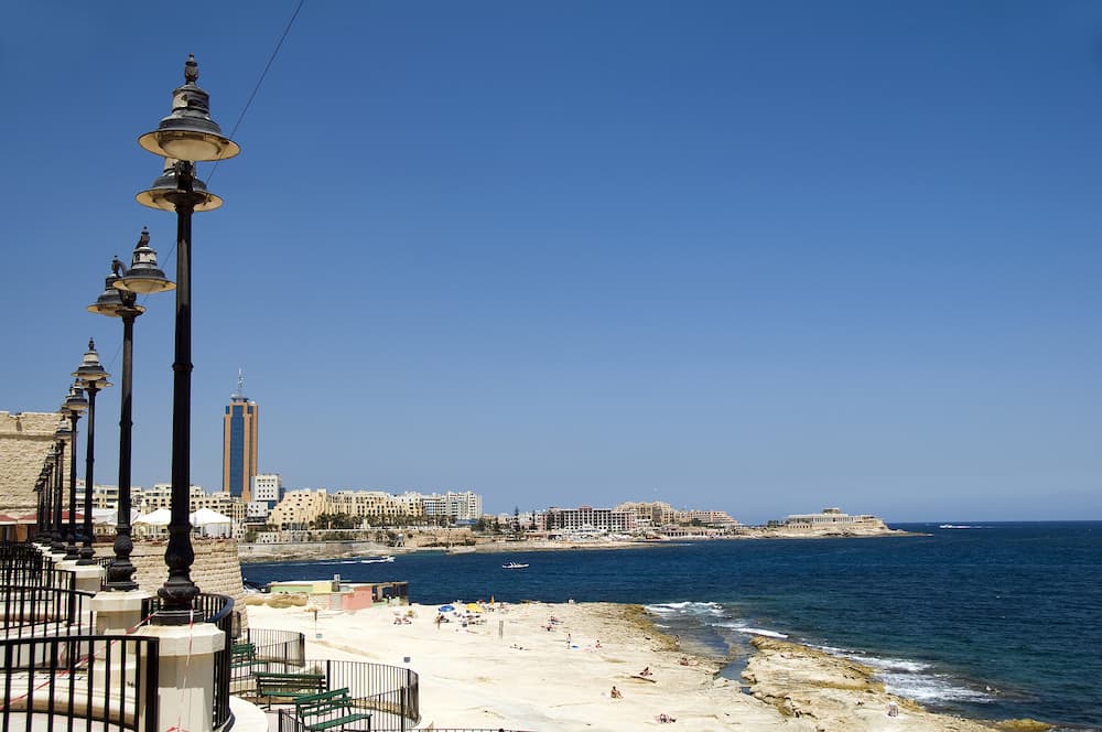seaside promenade limestone caraved beach and hotel development sliema st. julian's paceville malta mediterranean sea