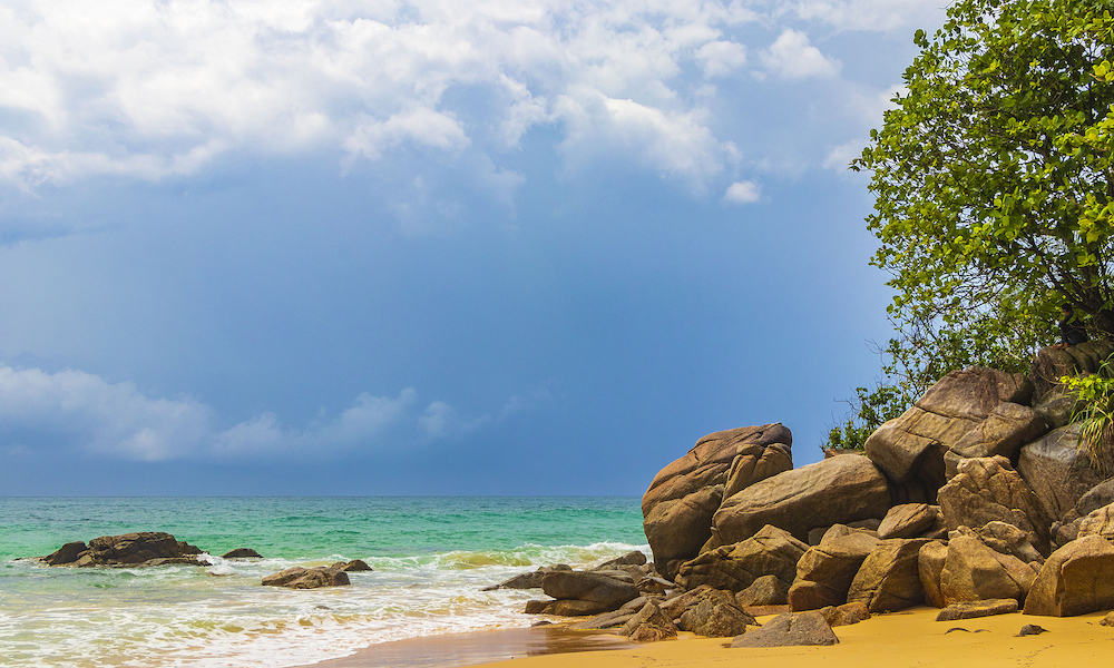 Nai Thon Naithon Beach bay and landscape panorama a beautiful dream beach with turquoise clear water and waves in Sakhu Thalang on Phuket island Thailand in Southeastasia Asia.