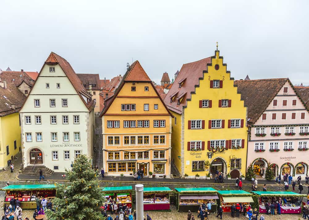 ROTHENBURG Tourists at the market place of Rothenburg ob der Tauber Germany. The medieval town attracts over 2 million visitors every year.
