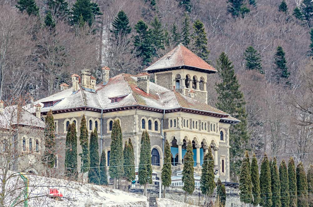 The Cantacuzino Palace (Palatul Cantacuzino) from Busteni Romania winter time with snow and ice.