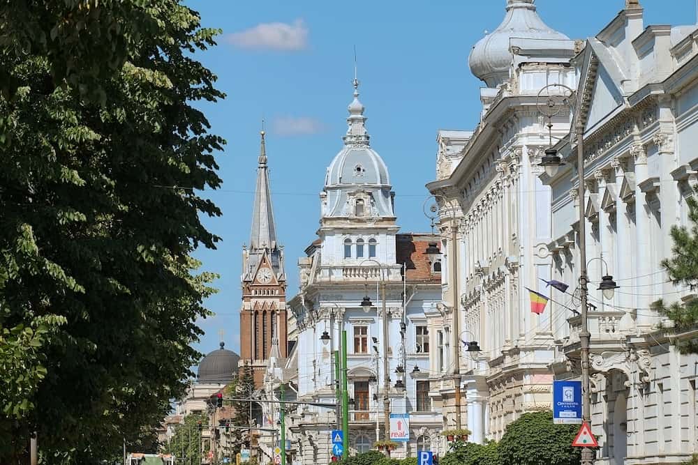 ARAD, ROMANIA - domes and bell tower of University Aurel Vlaicu and City Hall Palace along Revolution Avenue of Arad.