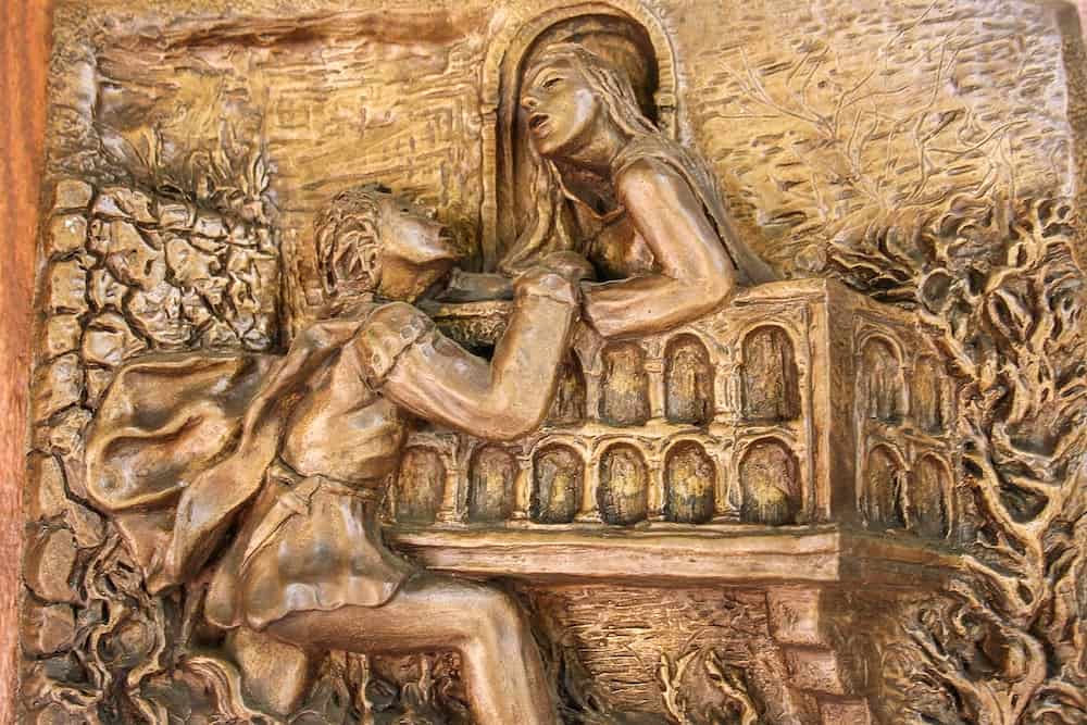 VERONA, ITALY - The bronze artwork of Sergio Pasetto which describes Romeo and Juliet's love story at Tomba di Giulietta (Tomb of Juliet).