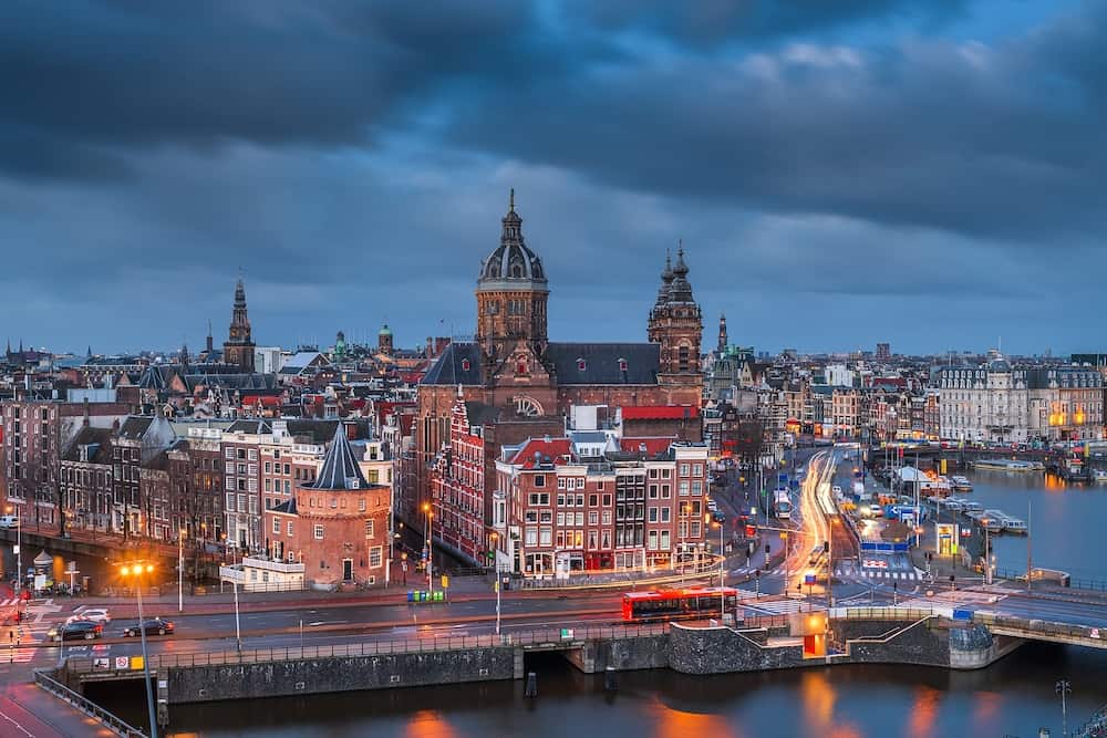 Amsterdam, Netherlands town cityscape over the Old Centre District with Basilica of Saint Nicholas.