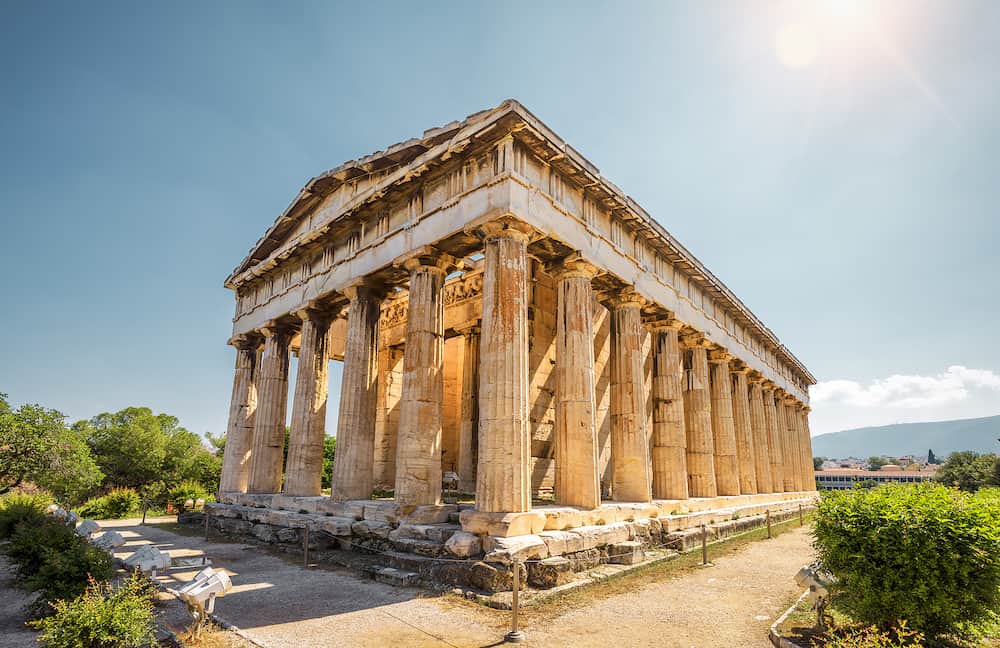 Temple of Hephaestus in Agora, Athens, Greece. It is one of the main landmarks of Athens. Sunny view of the ancient Greek Temple of Hephaestus. Famous historical architecture of Athens in sun light.