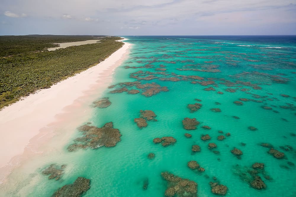 Aerial view of the dotted coral formations along the Atlantic Ocean side of Cat Island, Bahamas