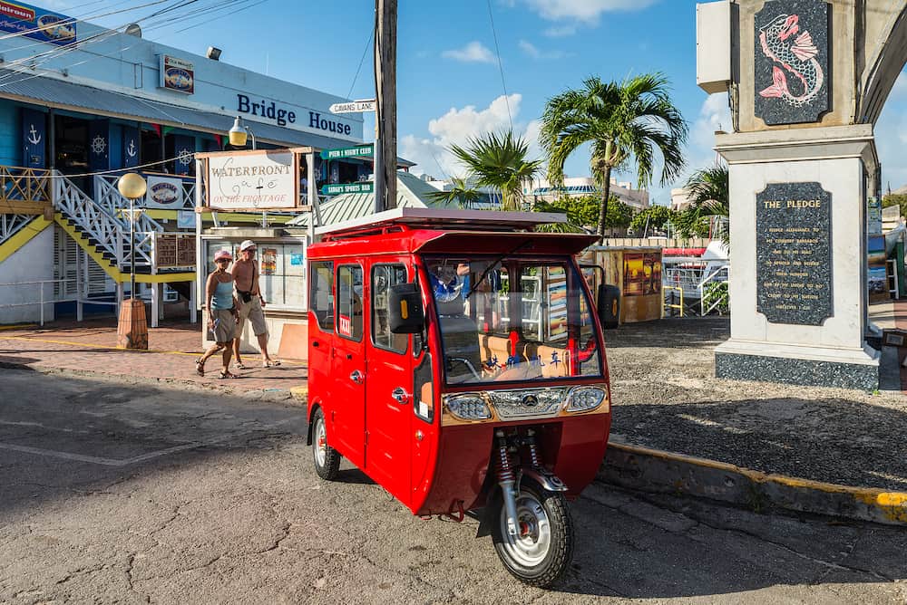 Bridgetown, Barbados - Local red taxi wait for passengers in Bridgetown, Barbados, West Indies, Caribbean, Central America.