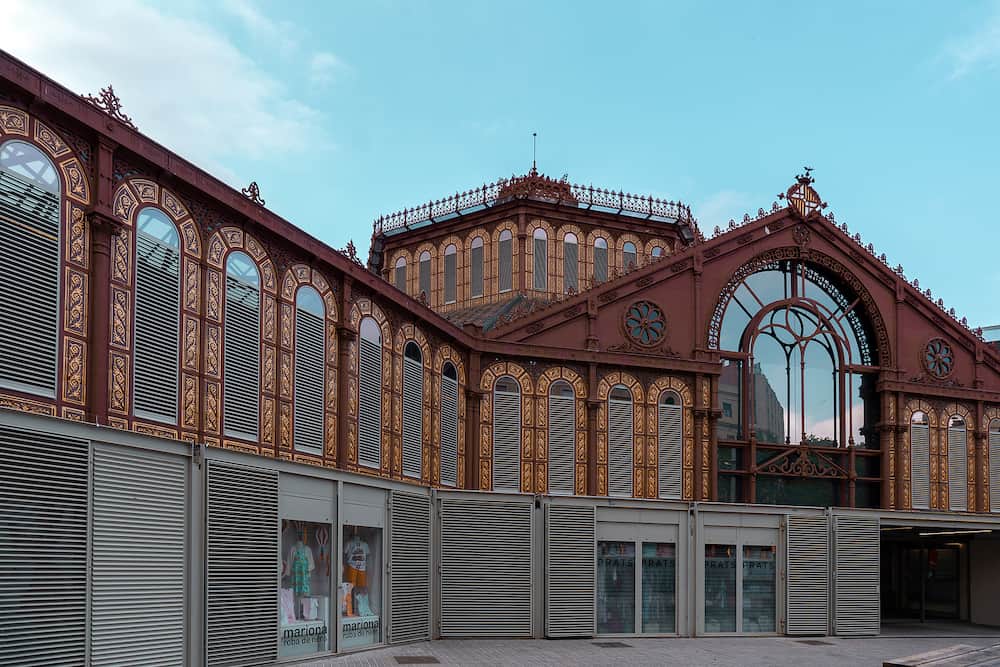Barcelona, Spain - Exterior of the public market of Sant Antoni in Barcelona. Decorated windows and steel structure of the building