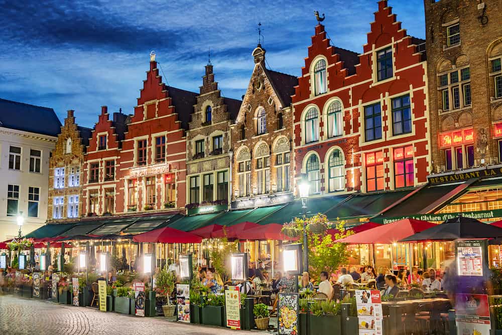 BRUGES, BELGIUM - Architecture of the historical market square of Bruges in the Flemish Region of Belgium, after sunset