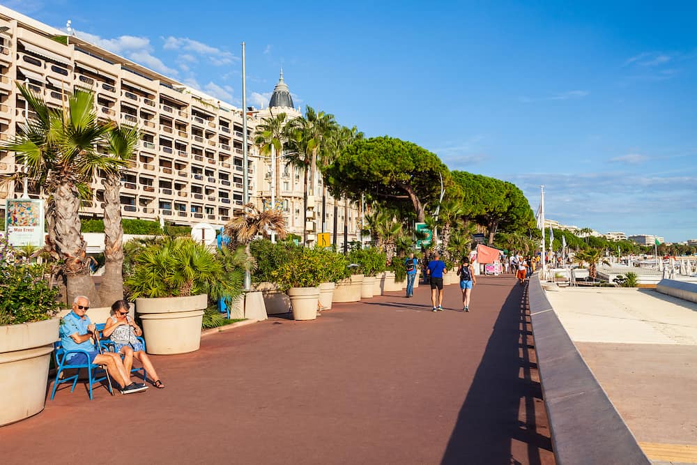 CANNES, FRANCE - Promenade de la Croisette or Boulevard de la Croisette is a prominent road in Cannes city in France