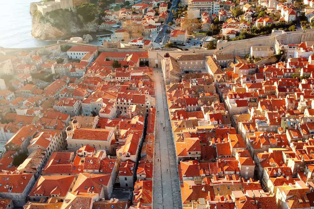 Amazing panoramic sunset drone view of old city of Dubrovnik, Croatia. The Stradun street. View of the historical center and view of the residential part of the cityqAmazing panoramic sunset drone view of old city of Dubrovnik, Croatia. The Stradun street. View of the historical center and view of the residential part of the city