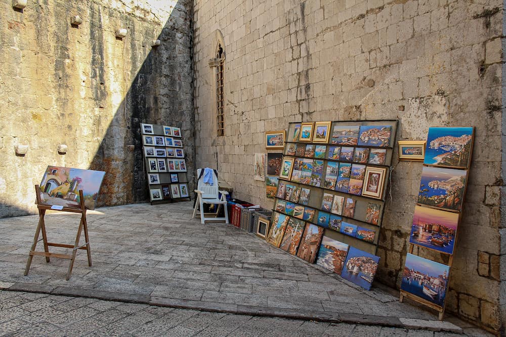 Dubrovnik, Croatia - An artists stall in Dubrovnik's old town in a late summers afternoon, Croatia